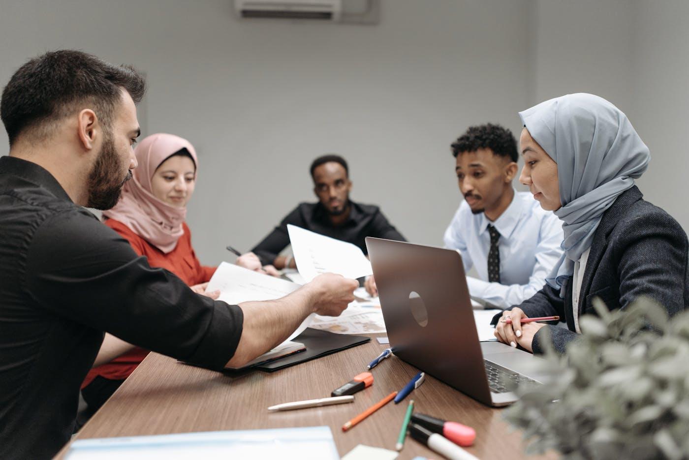 Moroccan professionals collaborating in office meeting