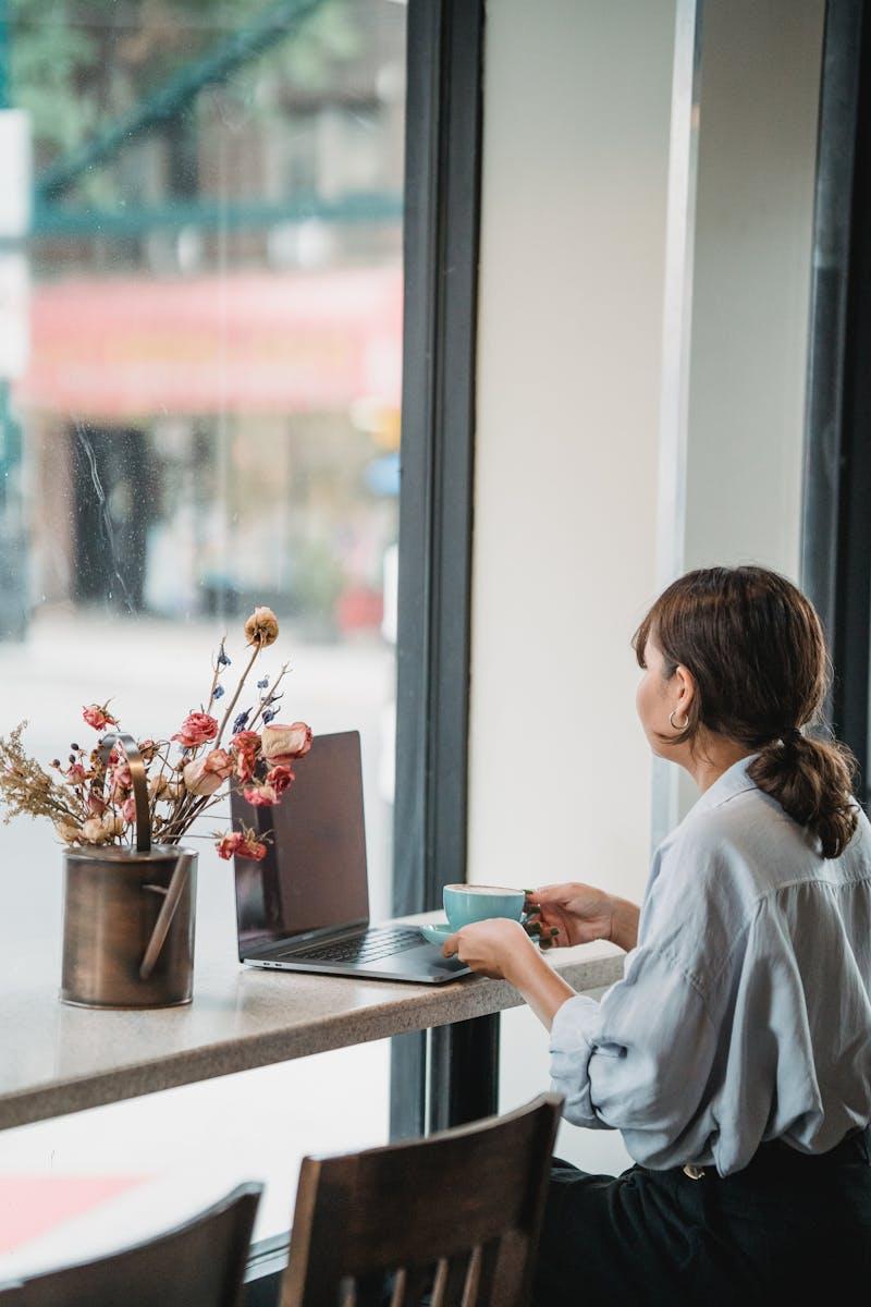 Professional connecting remotely from café